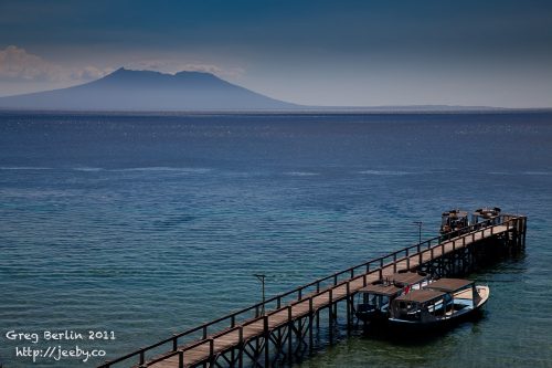 Menjangan Island jetty with Java in the background, Bali, Indonesia