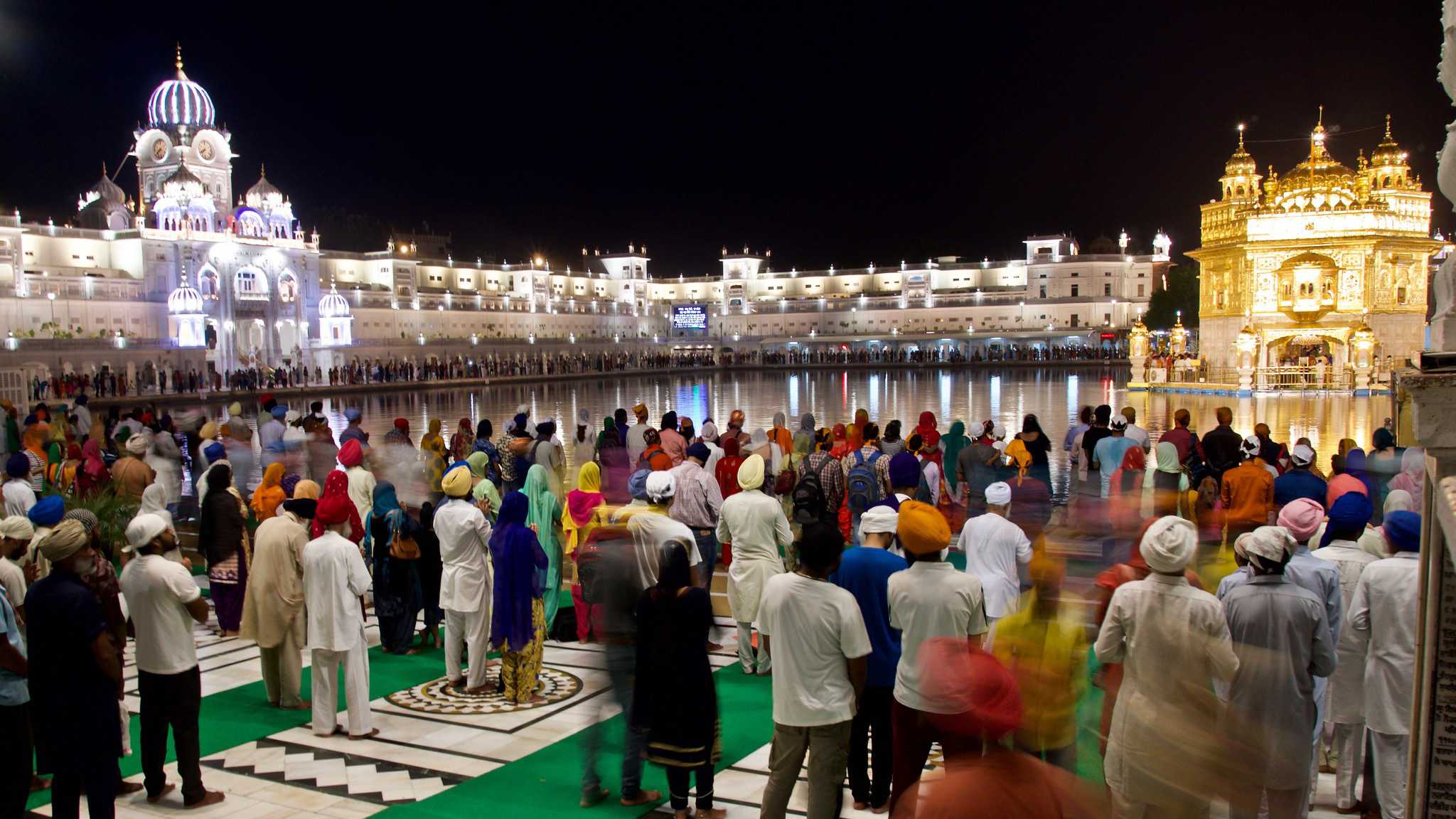 Nighttime Crowd At The Golden Temple